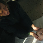 Jennifer Kellow, RN, performing Alexander Technique on a baby